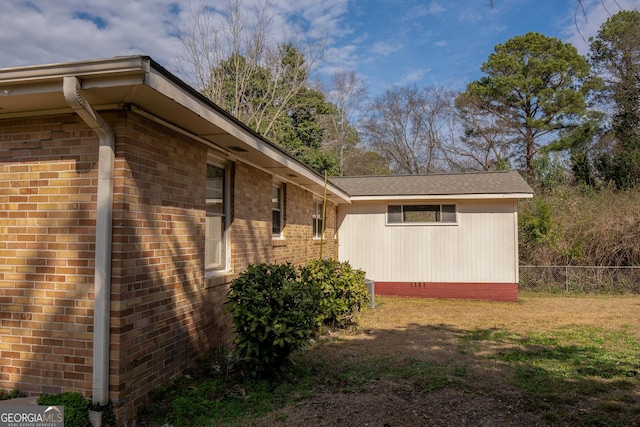 view of property exterior with a lawn