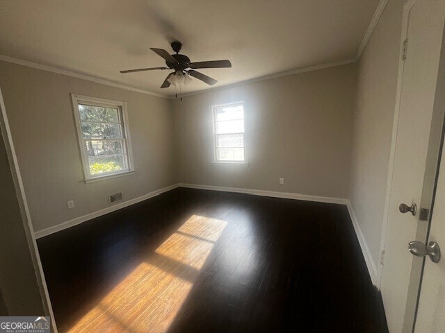 spare room with wood-type flooring, ornamental molding, and ceiling fan