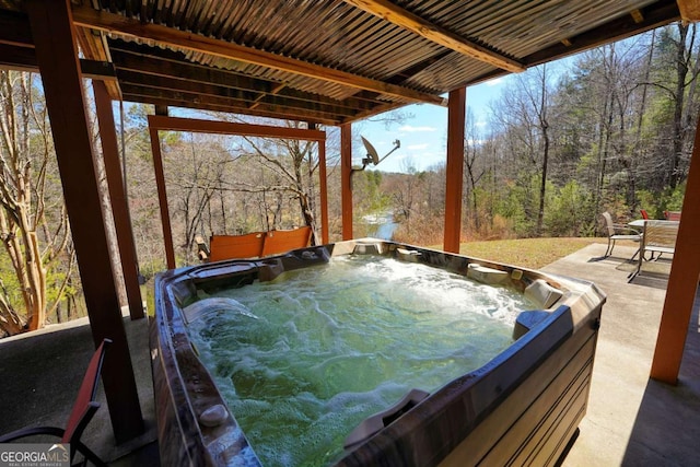 exterior space featuring a hot tub