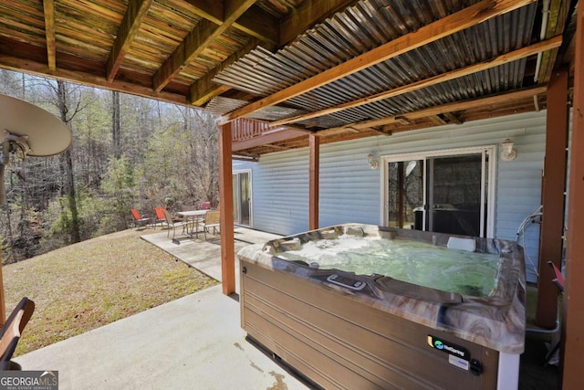 view of patio / terrace with a hot tub