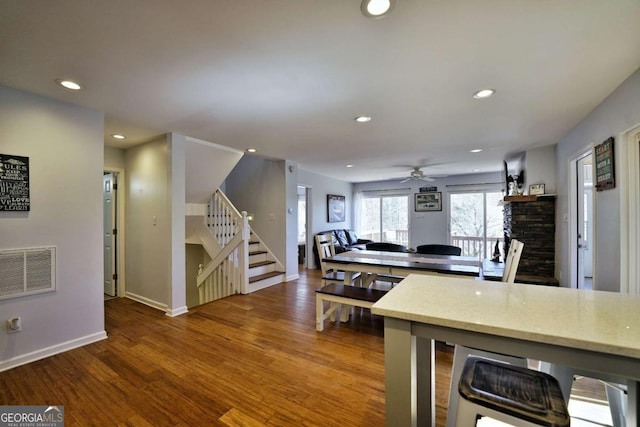 kitchen featuring ceiling fan and hardwood / wood-style floors