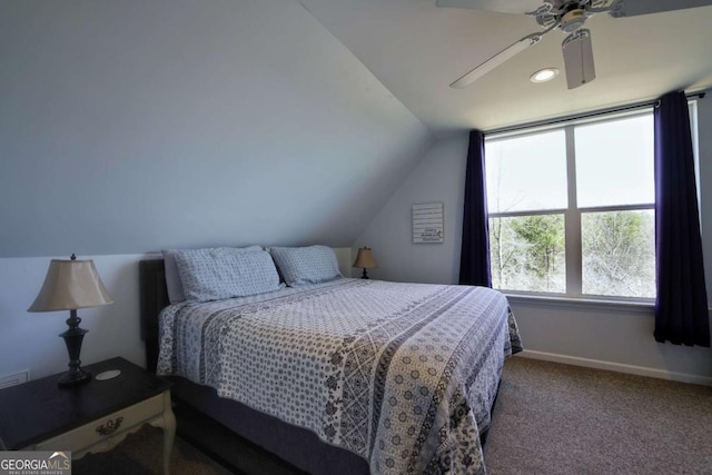 carpeted bedroom with ceiling fan and lofted ceiling