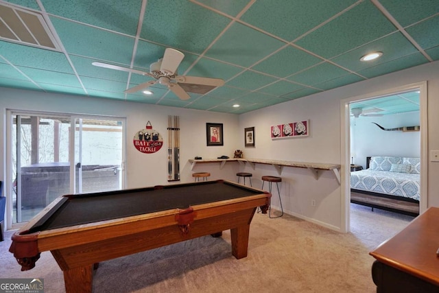 recreation room featuring carpet flooring, ceiling fan, a drop ceiling, and billiards