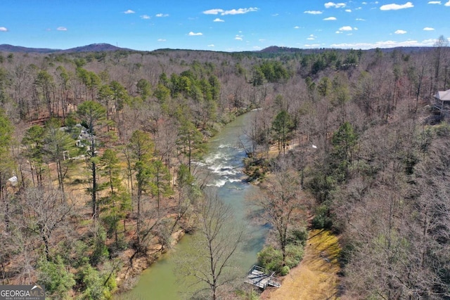 aerial view featuring a water and mountain view