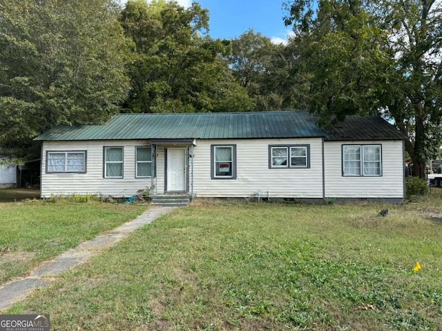 ranch-style house with a front lawn