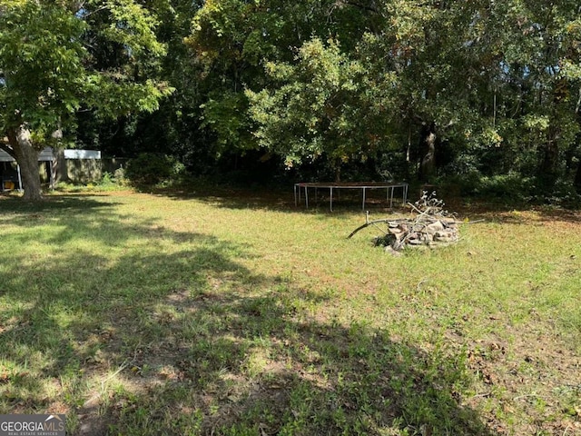 view of yard with a trampoline