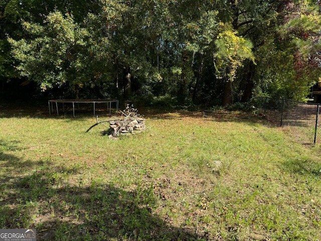 view of yard with a trampoline