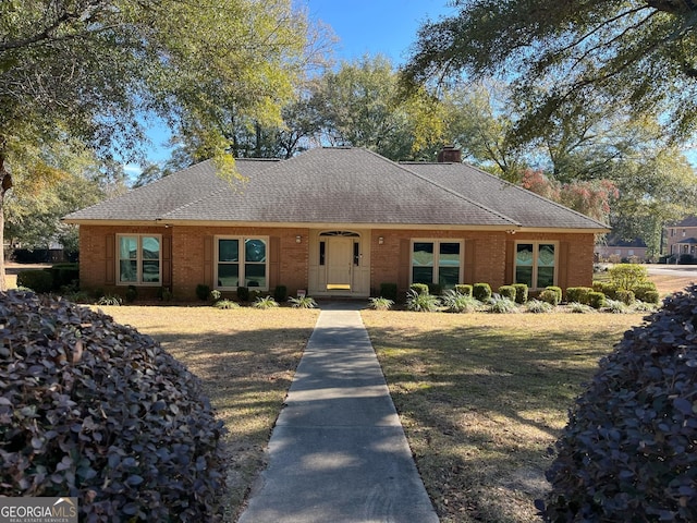 ranch-style house with a front lawn