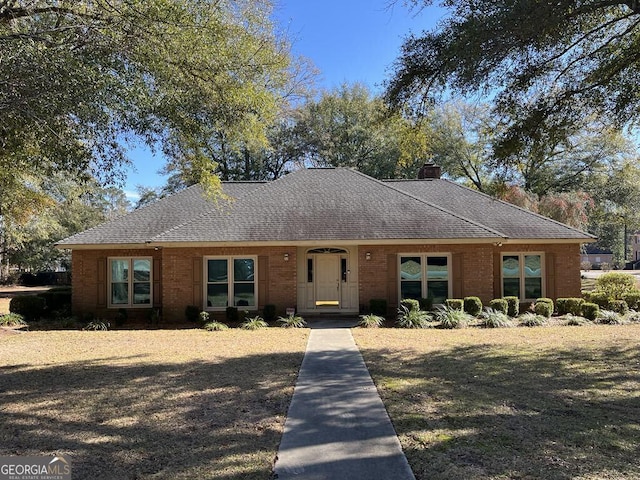 single story home with a front yard