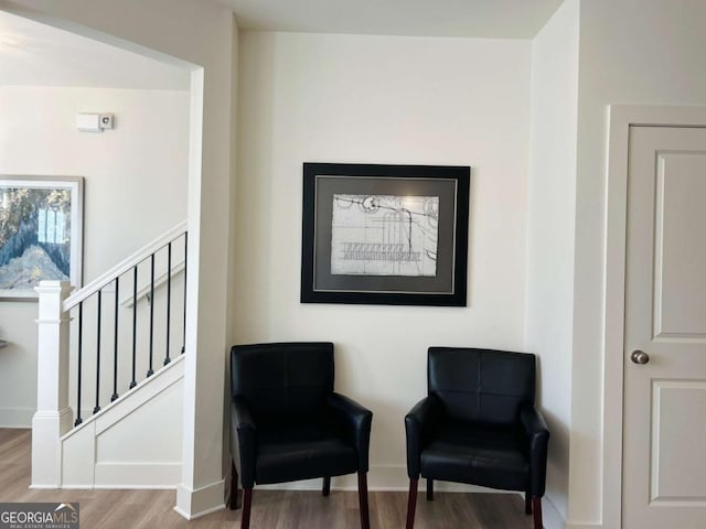 sitting room with hardwood / wood-style floors