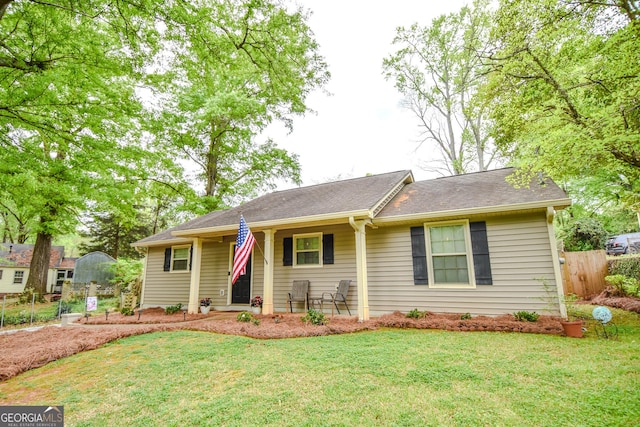 ranch-style home with a front lawn