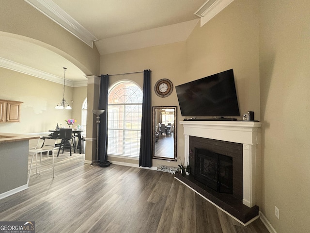 living room featuring hardwood / wood-style flooring and ornamental molding