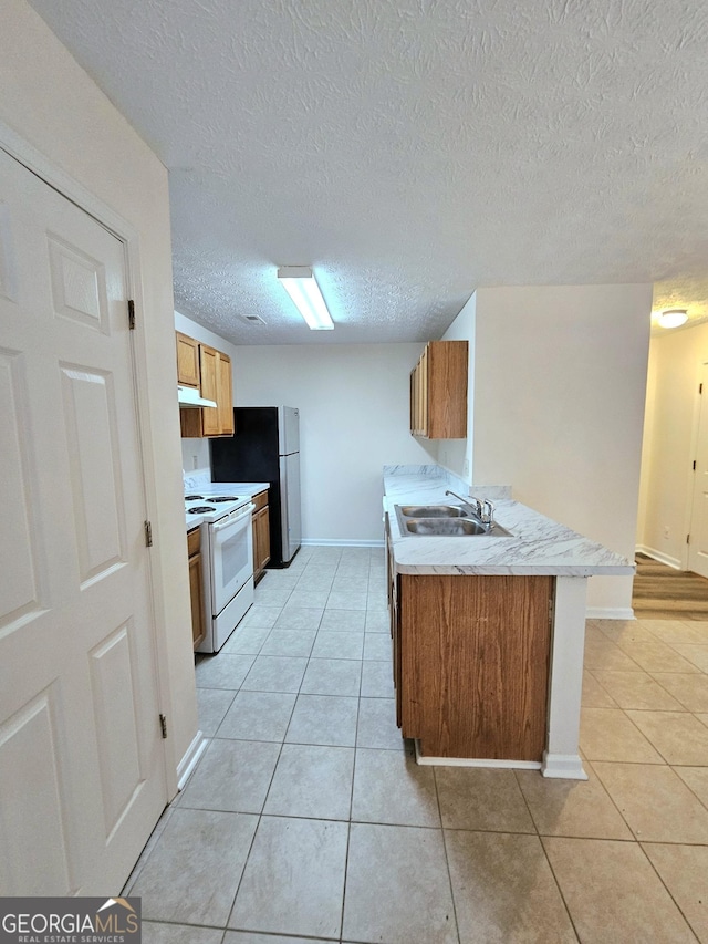 kitchen with kitchen peninsula, a textured ceiling, sink, white range with electric cooktop, and light tile patterned flooring