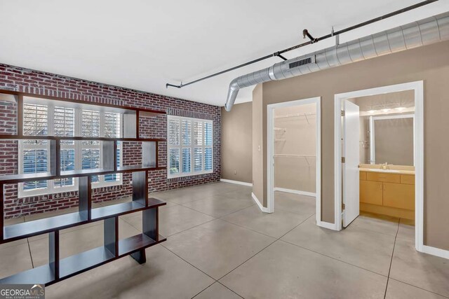 kitchen featuring electric panel, electric stove, and light brown cabinets