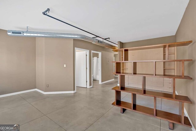 interior space with brick wall and sink