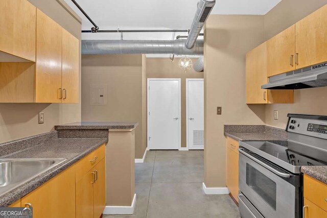 kitchen featuring light brown cabinetry and appliances with stainless steel finishes