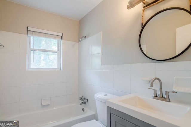 full bathroom featuring toilet, decorative backsplash, vanity, tile walls, and tiled shower / bath