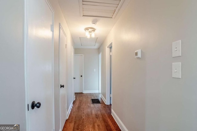 hall with dark wood-type flooring