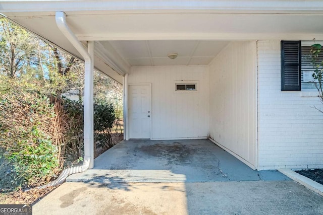 entrance to property featuring a carport