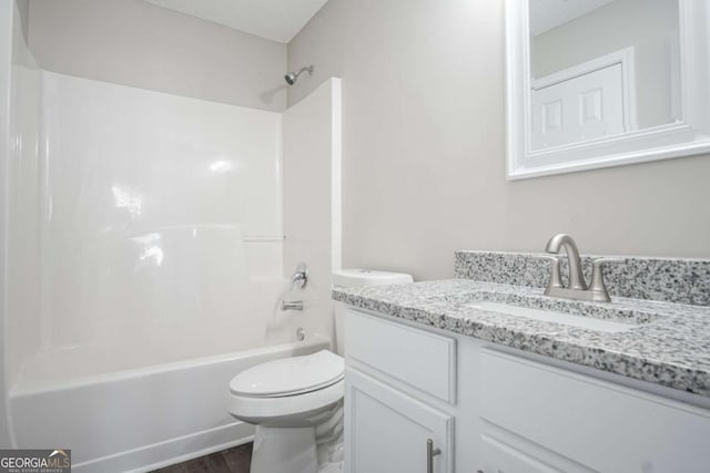 full bathroom featuring bathing tub / shower combination, vanity, wood-type flooring, and toilet