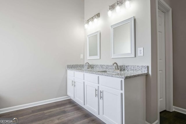 bathroom featuring hardwood / wood-style floors and vanity