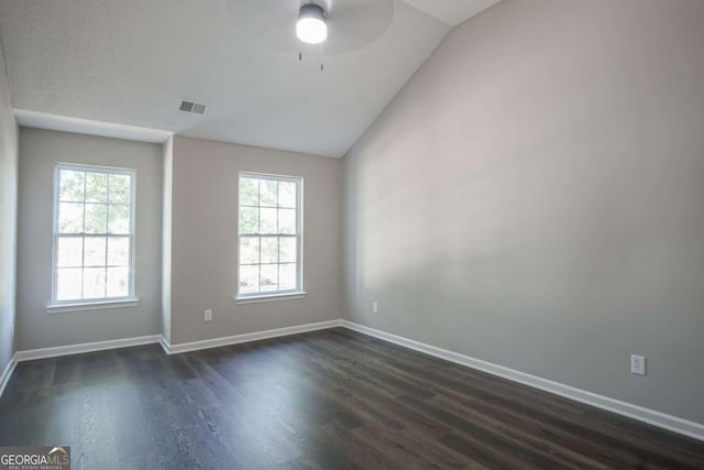 spare room featuring dark hardwood / wood-style floors, ceiling fan, and lofted ceiling