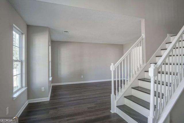 stairs with hardwood / wood-style flooring