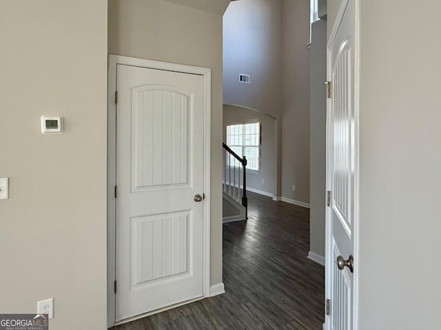 corridor with dark wood-type flooring