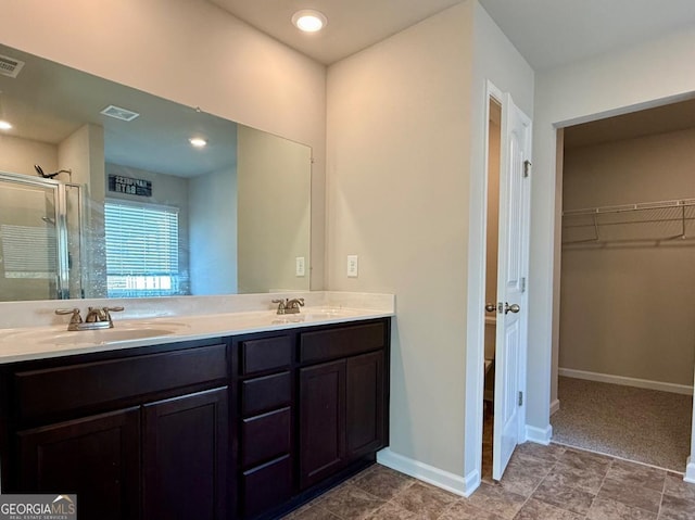 bathroom with vanity and walk in shower