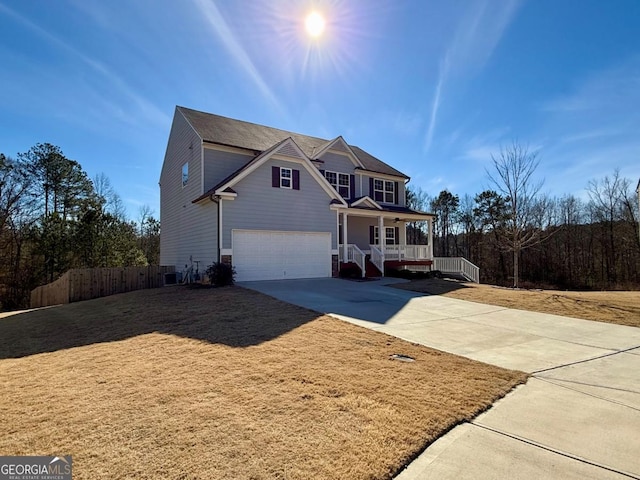 front facade with covered porch and a garage