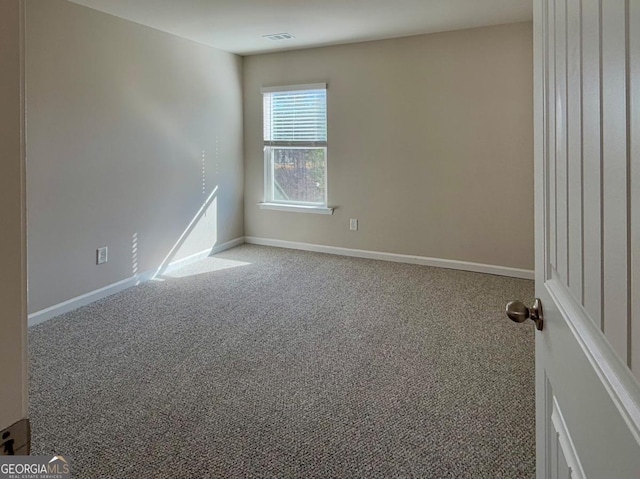 view of carpeted spare room