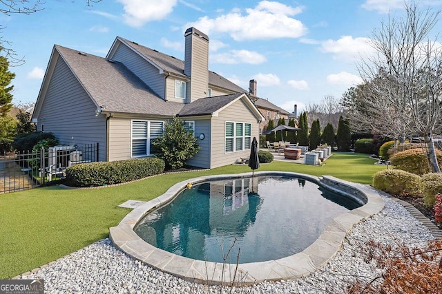 back of property featuring outdoor lounge area, a patio area, and a yard