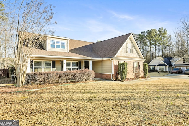 view of front of home featuring central AC and a front lawn