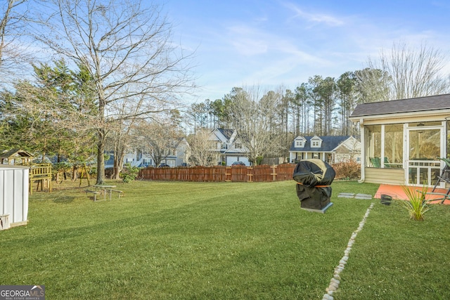 view of yard featuring a sunroom