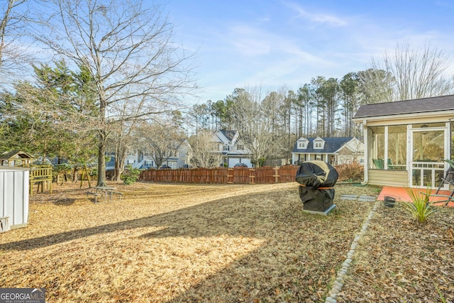 view of yard with a sunroom