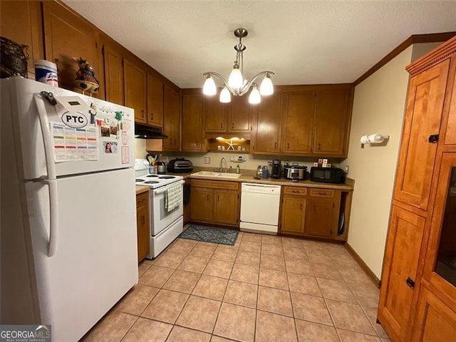 kitchen with sink, an inviting chandelier, decorative light fixtures, white appliances, and light tile patterned flooring