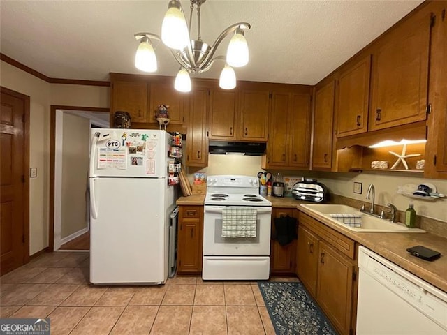 kitchen with white appliances, an inviting chandelier, sink, ornamental molding, and decorative light fixtures