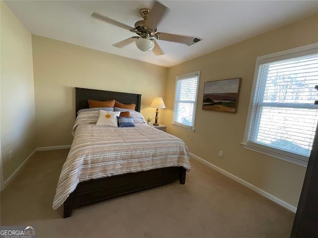 carpeted bedroom featuring ceiling fan