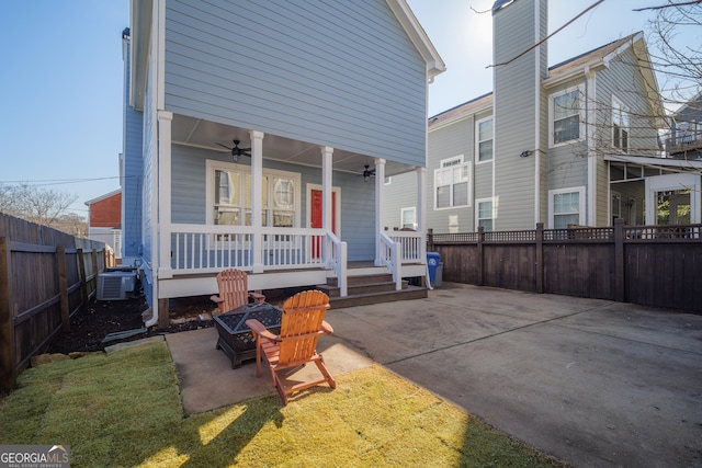 back of house featuring central air condition unit, ceiling fan, and a porch