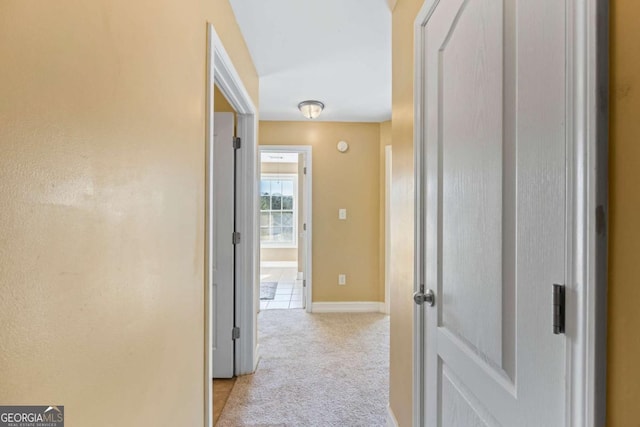 hallway with light carpet