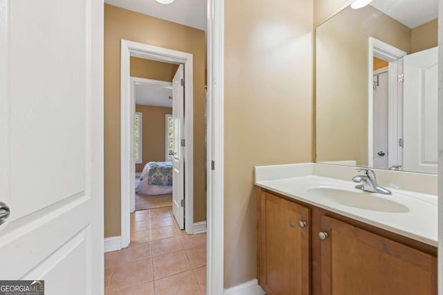 bathroom featuring tile patterned flooring and vanity