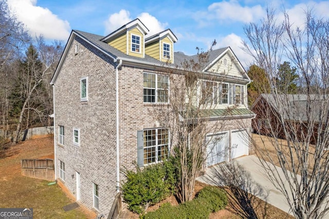 view of property exterior featuring a garage