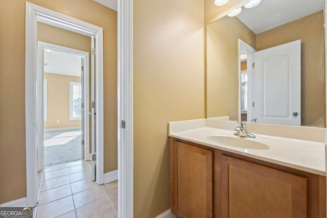 bathroom featuring tile patterned flooring and vanity