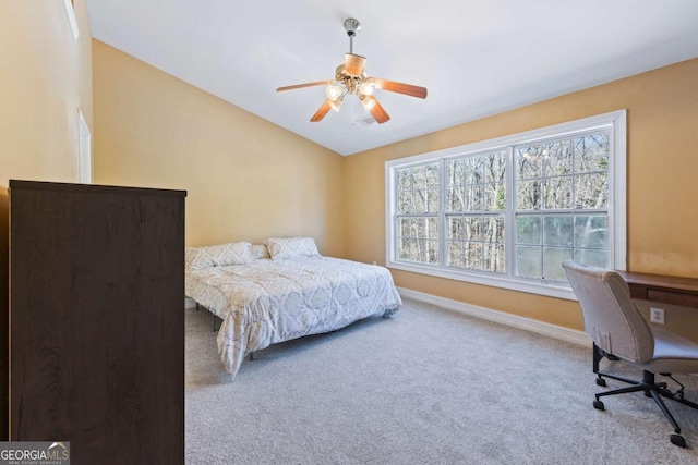 bedroom with carpet flooring, ceiling fan, and vaulted ceiling