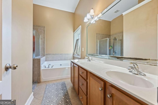 bathroom featuring tile patterned floors, vanity, and independent shower and bath