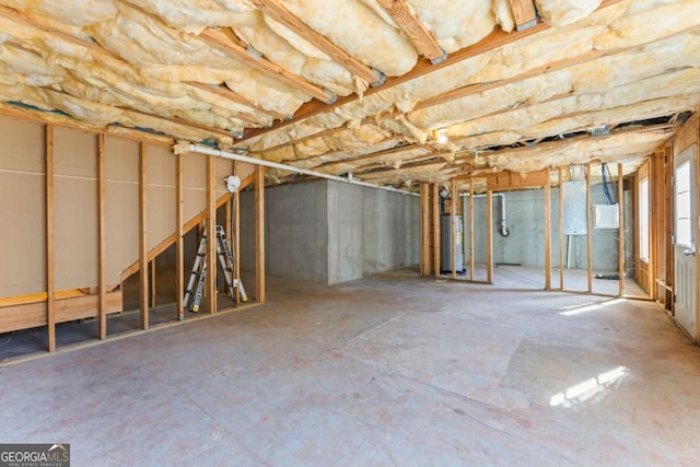 basement with electric panel and water heater