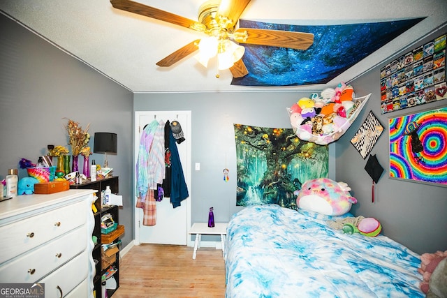 bedroom featuring ceiling fan and light hardwood / wood-style flooring