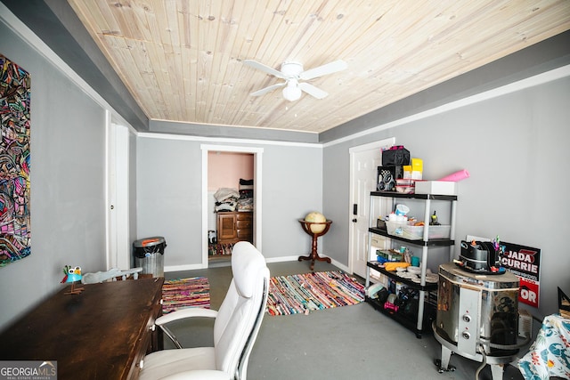 home office with concrete flooring, ceiling fan, and wood ceiling