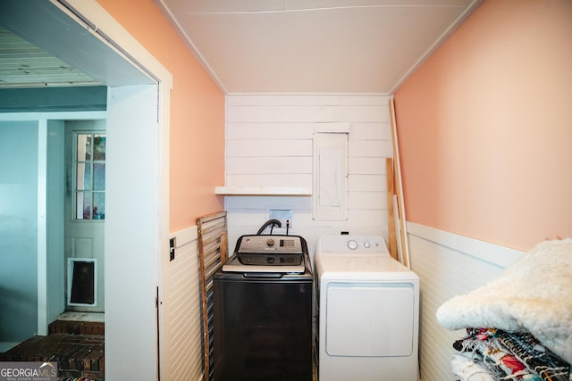 clothes washing area featuring separate washer and dryer and electric panel