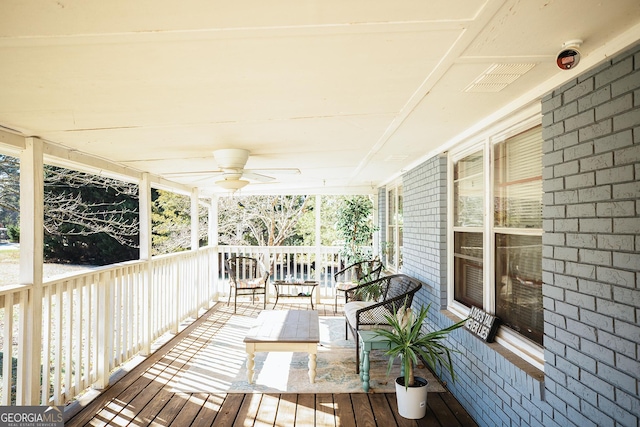 deck featuring a porch and ceiling fan